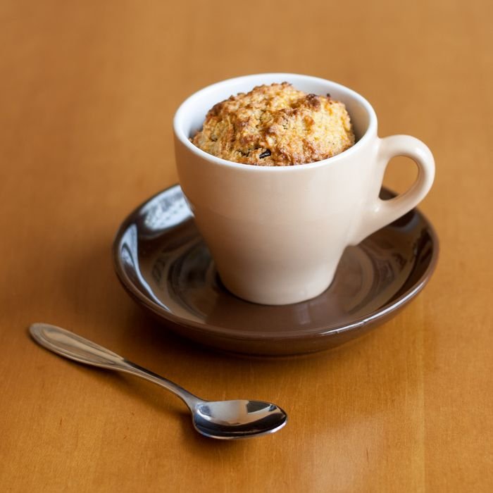 pexels-photo-2764272-2764272 Warm mug cake in a white cup on a brown saucer with a spoon on a wooden table.